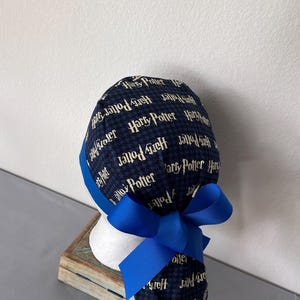 Avengers Ponytail Scrub Hat: Pediatric Nurse, Adjustable Buttons. Harry Potter blue