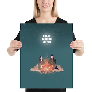 May include: A teal blue poster with a starry night sky background. The poster features a couple sitting by a campfire with the text "Crash Landing On You" in white.