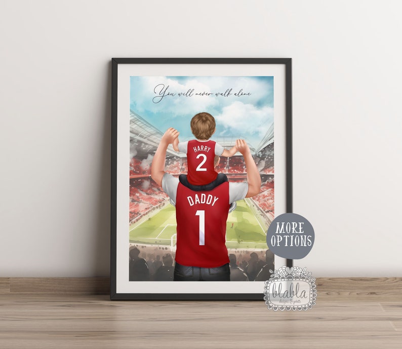 May include: A watercolor illustration of a father and son wearing matching soccer jerseys. The father is holding the son on his shoulders. The son's jersey says "Harry" and "2" and the father's jersey says "Daddy" and "1". The background is a soccer stadium with a green field and red seats. The text "You will never walk alone" is written at the top of the image.