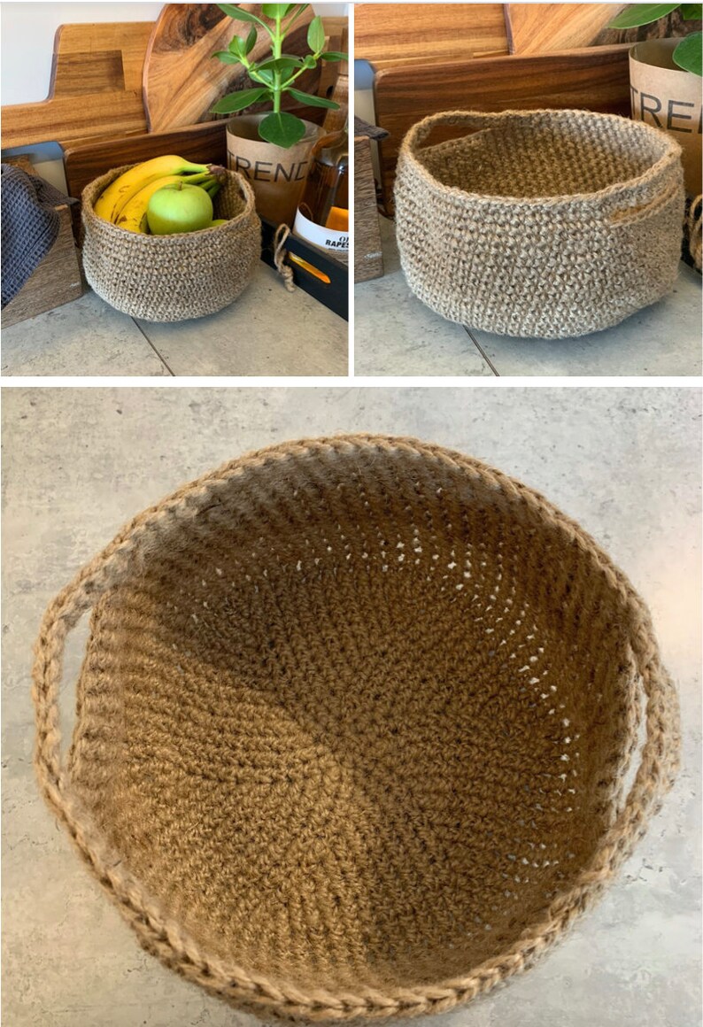 May include: A brown, crocheted, jute basket with two handles. The basket is empty and sitting on a light gray surface.