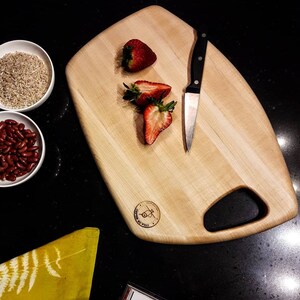1950&#39;s mid century modern inspired edge grain hard maple cutting board.