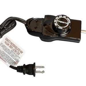May include: Black Presto electric knife with a cord and plug. The knife has a dial with temperature settings from 180 to 400 degrees Fahrenheit. The dial also has an "OFF" setting. The label on the cord reads "DO NOT USE WITH AN EXTENSION CORD".