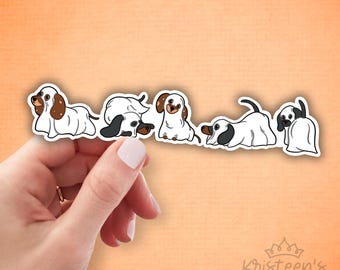 May include: Five white ghost dog stickers with brown and black markings. The dogs are in various poses, including sitting, lying down, and standing. The stickers are ideal for adding a touch of Halloween fun to any surface.