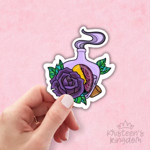 May include: A purple and yellow potion bottle with a purple rose and green leaves. The bottle has a cork stopper and a purple smoke coming out of the top.