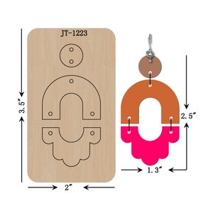 May include: A wooden die-cutting template for making earrings. The template includes three shapes: a circle, a large U-shape, and a smaller U-shape with a scalloped edge. The template is labeled JT-1223. The finished earrings are shown in the image, with the large U-shape in orange and the smaller U-shape in pink.