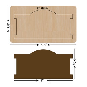May include: A wood craft die with a 6.8 inch by 3.8 inch rectangular shape with an arched top. The die is designed to cut out a 6 inch by 3 inch rectangle with an arched top. The die is labeled JT-3955.