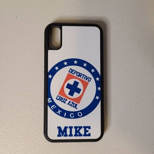 May include: A white phone case with a black border featuring the Deportivo Cruz Azul logo in blue, red, and white. The name "MIKE" is printed in blue below the logo. The case is designed for a smartphone.