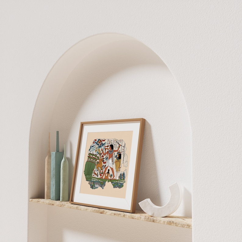 May include: A framed print of an ancient Egyptian scene depicting a man with a staff and a woman with a basket. The scene is painted in a colorful style with a light brown background.