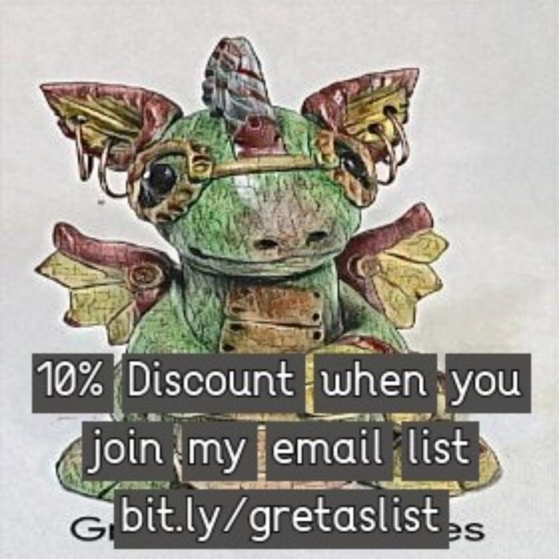May include: A green and gold steampunk-style dragon figurine with wings and a horn. The dragon is sitting on a white background with text that reads "10% Discount when you join my email list bit.ly/gretaslist".
