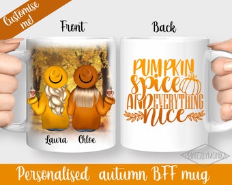 May include: Personalized autumn themed mug with two women in fall outfits and the text "Laura" and "Chloe" on the front. The back of the mug has the text "Pumpkin Spice and Everything Nice" in orange and brown.