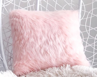 blush fluffy cushions