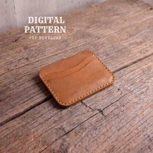 May include: A tan leather card holder with rounded corners and yellow stitching, featuring a curved pocket design. The text DIGITAL PATTERN PDF DOWNLOAD is visible in the upper left corner of the image, indicating a downloadable template.