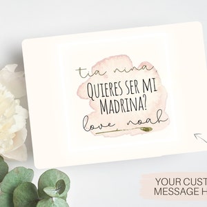 May include: A pink watercolour card with the text "Tia Nina, quieres ser mi madrina? Love, Noah".