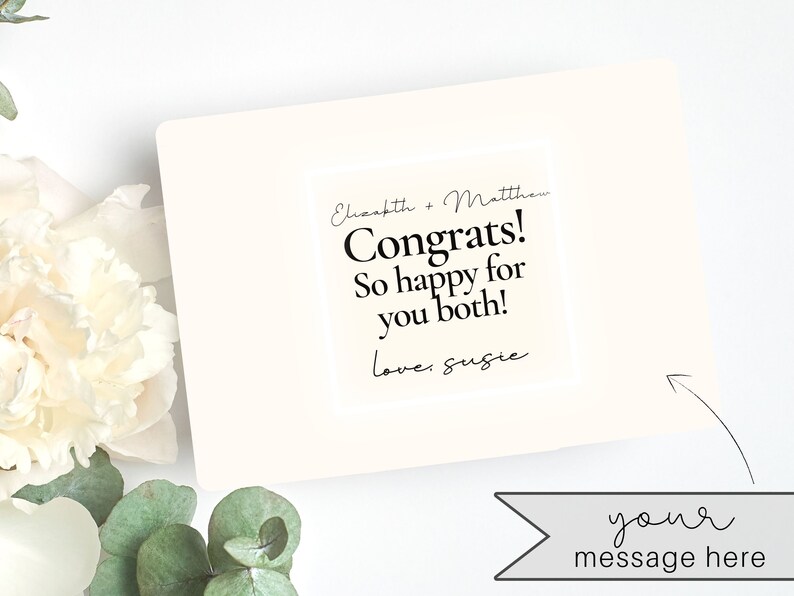 May include: A white card with black text that reads "Elizabeth & Matthew Congrats! So happy for you both! love: Susie" and the words "your message here" in a banner below the card.