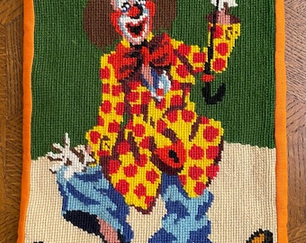Delightful iPad bag made from a cross-stitch embroidery of a clown with an orange backing fabric, padded iPad bag for extra protection