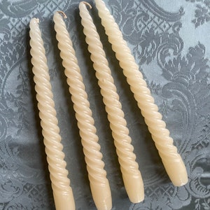 Four vintage cream coloured spiral twisting tapered candle sticks