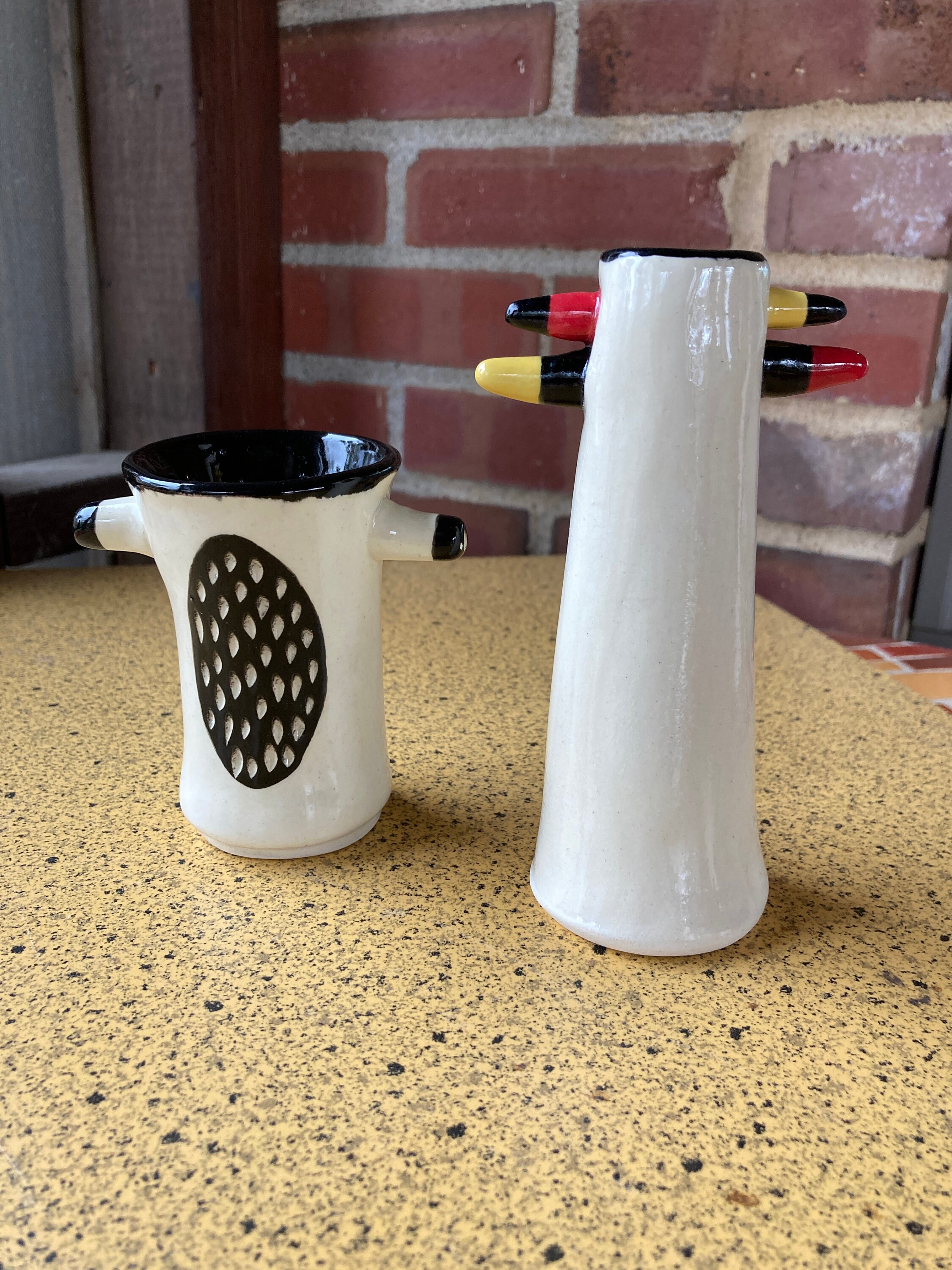 Two handmade ceramic bud vases. Each with their own Etsy
