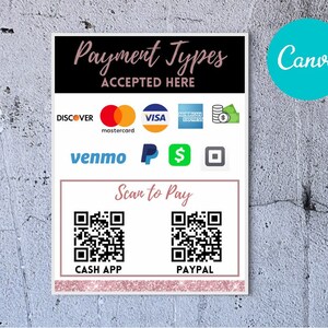 May include: A white sign with pink borders and the text "Payment Types Accepted Here" in black cursive font. The sign lists various payment methods including Discover, Mastercard, Visa, American Express, Venmo, PayPal, Cash App, and a QR code for each. The sign also includes a green dollar sign and a white square with a black outline.