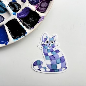 Quilted Cat Sticker – Purple Patchwork Cat Vinyl Sticker, Cozy and Whimsical Art for Cat Lovers and Crafty Souls