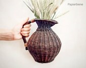 Wicker basket vase decor country house. Wicker flower basket. Shelf baskets, ikebana vase, woven flower basket. Farmhouse Decor, for kitchen