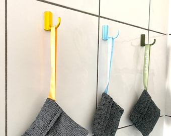 Universal adhesive hooks for towels, washcloths, soap bags and much more.