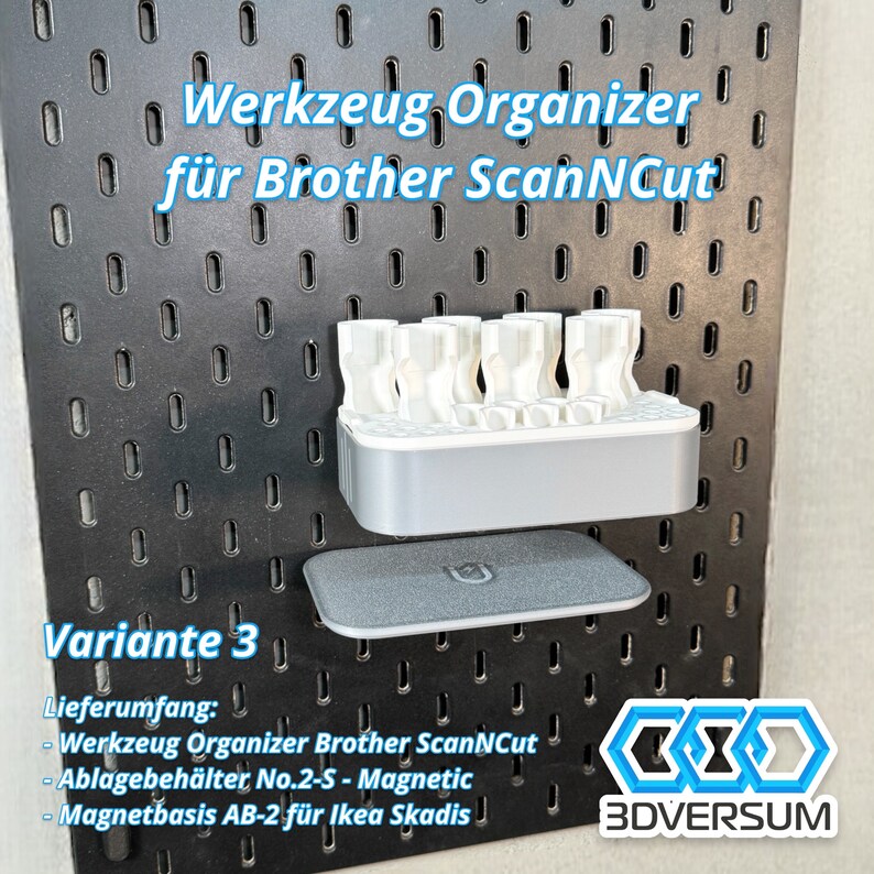 May include: A black pegboard with a white and gray organizer for Brother ScanNCut tools. The organizer holds several white tool holders. A gray magnetic base is below the organizer. Text on the board reads "Werkzeug Organizer f&uuml;r Brother ScanNCut" and "Variante 3".