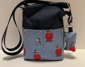 Dog walking bag with poop bag dispenser. Snoopy the Red Baron