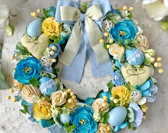 春のリースとイースターの装飾、イースターの飾り、花のついた春のリースと春のドアのリース