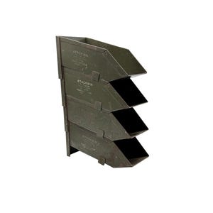 May include: A stackable, olive green metal storage bin with four angled compartments. Each compartment has a rectangular opening and is labeled "STACKBIN". The bins are designed to be stacked vertically, offering a space-saving storage solution.