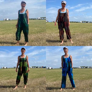 May include: Four images of a person wearing patchwork overalls in various colours: green, red, green and black, and blue. The overalls have pockets and are worn with a light blue vest top. The person wears a light grey cap and a necklace. The background is a grassy field under a blue sky.