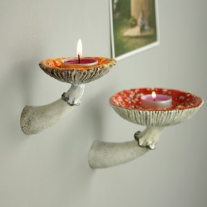 Small and meddium shelves with candles. Like the growing up from wall! Mushrooms are very naturalistics.