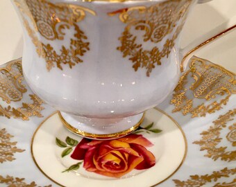 Paragon Fine Bone China Teacup and Saucer: Pale Blue, Gold Filigree, Floral Bouquet