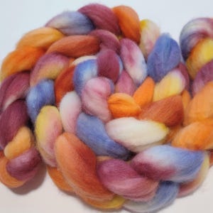 A PEMBERLEY SUNRISE 4oz braid of 100% bfl hand-dyed spinning fiber/roving