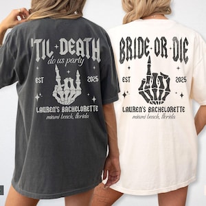 May include: Two oversized t-shirts, one pepper-colored and one ivory, with matching graphic designs. The designs feature skeleton hands, the text "'TIL DEATH do us party" and "BRIDE OR DIE", the year 2025, and "LAUREN'S BACHELORETTE miami beach, florida".