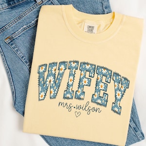 Personalized Wifey Shirt, Daisy New Bride Shirt, Custom Wifey T-Shirt, Floral Honeymoon Tshirt, Fiancee Tee, Coquette Bridal Shower Gift