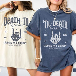 May include: Two oversized t-shirts, one ivory and one denim, featuring a skeleton hand gesture design. The ivory shirt reads "Death to my twenties" and the denim shirt says "'Til Death do us party". Both shirts include "Lauren's 30th Birthday" and "Miami Beach, FL".