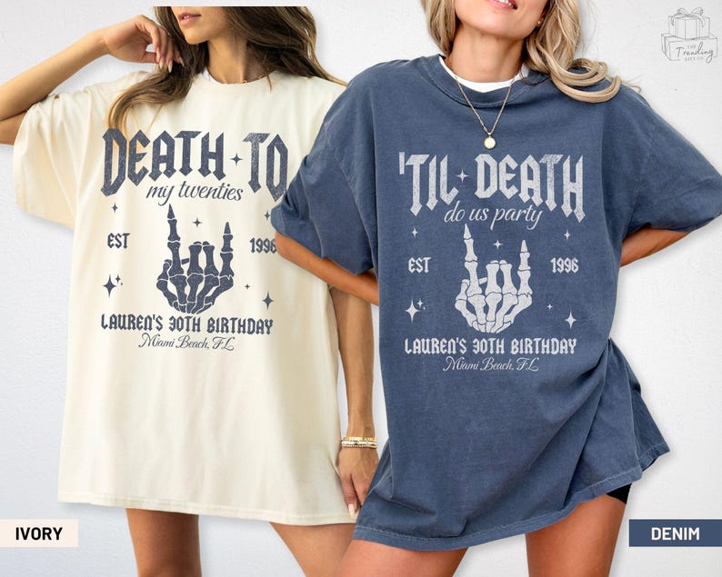 May include: Two oversized t-shirts, one ivory and one denim, featuring a skeleton hand gesture design. The ivory shirt reads "Death to my twenties" and the denim shirt says "'Til Death do us party". Both shirts include "Lauren's 30th Birthday" and "Miami Beach, FL".