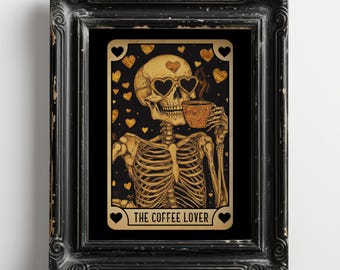May include: Framed art print featuring a skeleton with heart-shaped sunglasses and a coffee cup. The skeleton is surrounded by gold hearts on a black background. The text "THE COFFEE LOVER" is at the bottom. The frame is black with a distressed finish.