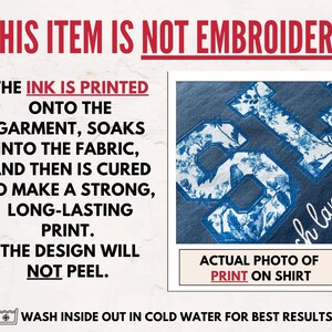 May include: A close-up of a blue t-shirt with a white floral print design. The text "This item is not embroidery" is at the top of the image. The text "Actual photo of print on shirt" is at the bottom of the image.