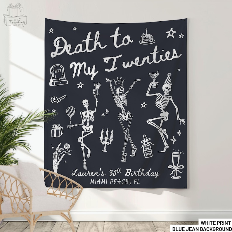 May include: A dark blue tapestry with white text and illustrations. The text reads "Death to My Twenties" with "Lauren's 30th Birthday, Miami Beach, FL" below. The design includes skeleton figures, stars, and party-themed graphics.