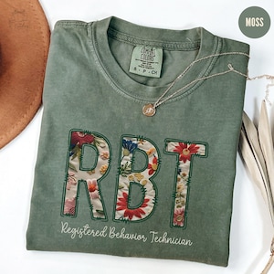 Komfortfarben RBT registriertes Verhaltenstechniker-Shirt, Aba-Therapeut-Geschenk mit Blumenmuster, niedliches Verhaltensanalytiker-T-Shirt, künstliche Stickerei Bcba-T-Stück