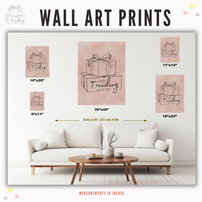 May include: A set of five wall art prints featuring a pink background with a black line drawing of stacked gift boxes. The text "THE TRENDING GIFT CO." is on the largest print. The prints are available in five sizes: 9x11 inches, 11x14 inches, 16x20 inches, 18x24 inches, and 30x40 inches.