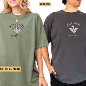 May include: Two unisex t-shirts with a goose graphic and the text "Mama Goose on the Loose" and "Dada Goose on the Loose". The shirts are in moss green and pepper colors.