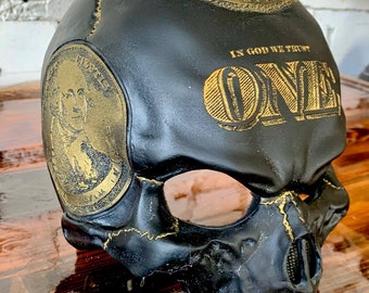 human skull engraved dead president dark + gold