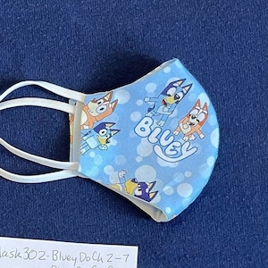 Bluey Mask for Child or Toddler. Choice of 3 styles of 2-layer Cotton Face Mask. Also: Bluey Bib & Tote Bag. See all photos and details.