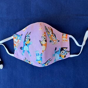 Bluey Face Mask for Child or Toddler: 2-Layer Cotton. Colors available are Blue and Pink. Also baby bib and tote bag. image 9