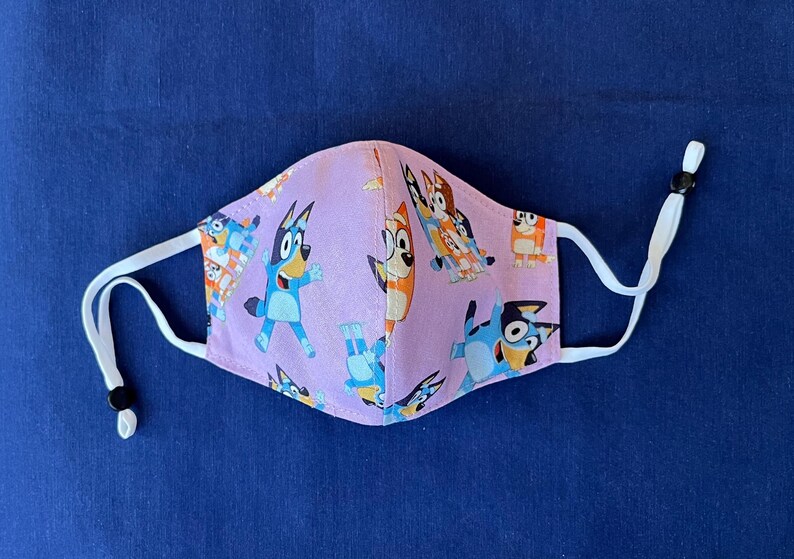 Bluey Face Mask for Child or Toddler: 2-Layer Cotton. Colors available are Blue and Pink. Also baby bib and tote bag. image 9