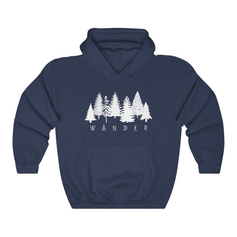 May include: A navy blue hooded sweatshirt with a white graphic of a row of trees and the word "WANDER" underneath.