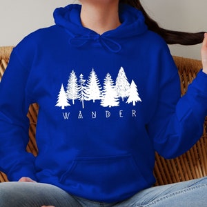 May include: A royal blue hoodie with a white graphic of a row of trees and the word "WANDER" underneath.