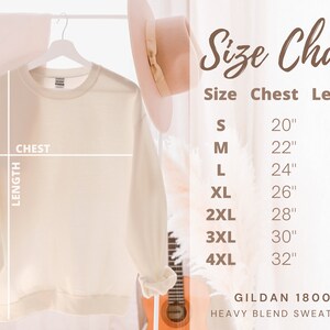 May include: Size chart for a Gildan 18000 heavy blend sweatshirt. The chart shows chest and length measurements in inches for sizes S through 4XL.